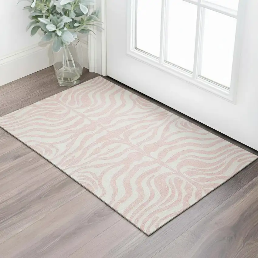 Pink And Ivory Animal Print Washable Area Rug With UV Protection Photo 2