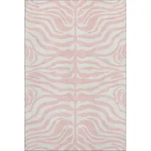 Photo of Pink And Ivory Animal Print Washable Area Rug With UV Protection