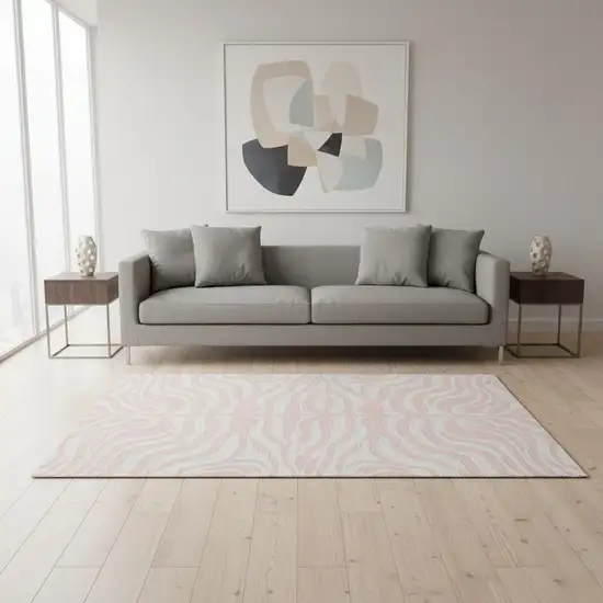 Pink And Ivory Animal Print Washable Area Rug With UV Protection Photo 2