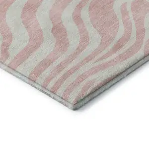 Photo of Pink And Ivory Animal Print Washable Area Rug With UV Protection