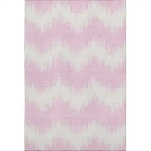 Photo of Pink And Ivory Chevron Washable Area Rug With UV Protection