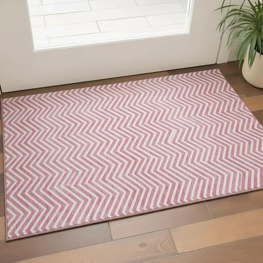 Pink And Ivory Chevron Washable Area Rug With UV Protection Photo 1