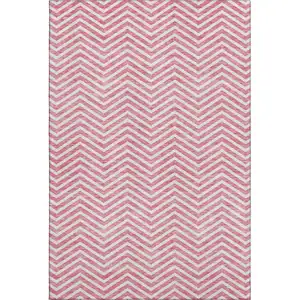 Photo of Pink And Ivory Chevron Washable Area Rug With UV Protection