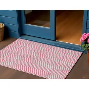Photo of Pink And Ivory Chevron Washable Indoor Outdoor Area Rug