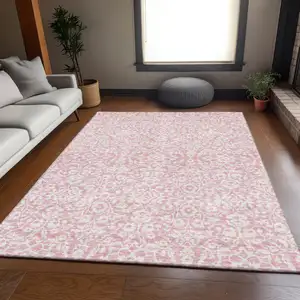 Photo of Pink And Ivory Damask Washable Area Rug With UV Protection