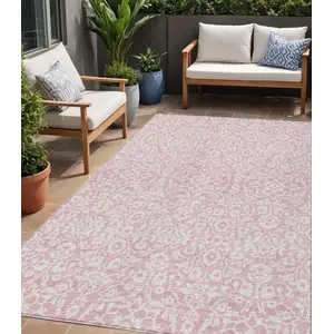 Photo of Pink And Ivory Damask Washable Indoor Outdoor Area Rug