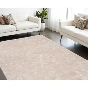 Photo of Pink And Ivory Floral Distressed Area Rug