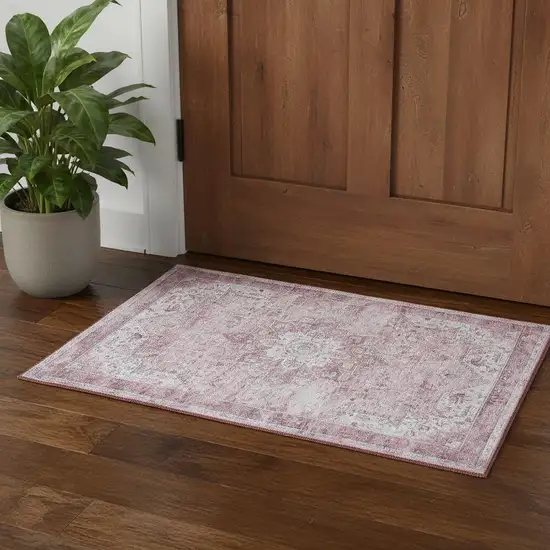 Pink And Ivory Floral Distressed Area Rug Photo 1