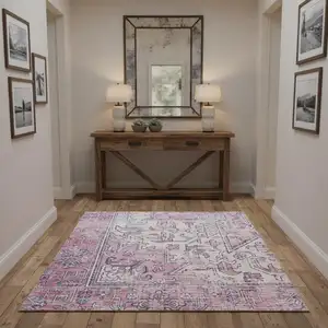 Photo of Pink And Ivory Floral Distressed Area Rug