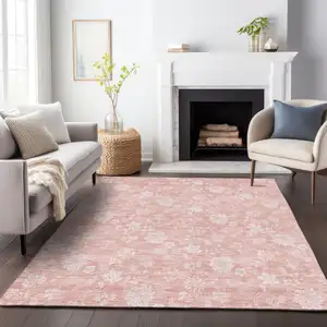 Photo of Pink And Ivory Floral Washable Area Rug With UV Protection