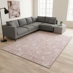 Photo of Pink And Ivory Floral Washable Area Rug With UV Protection