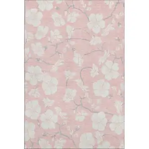 Photo of Pink And Ivory Floral Washable Area Rug With UV Protection