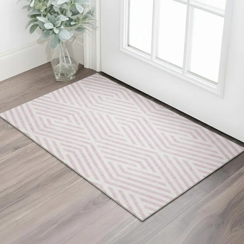 Pink And Ivory Geometric Washable Area Rug With UV Protection Photo 1