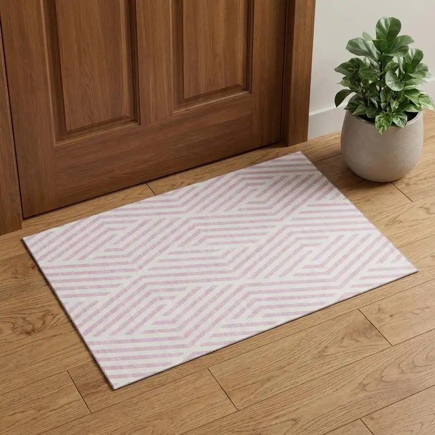 Pink And Ivory Geometric Washable Area Rug With UV Protection Photo 1
