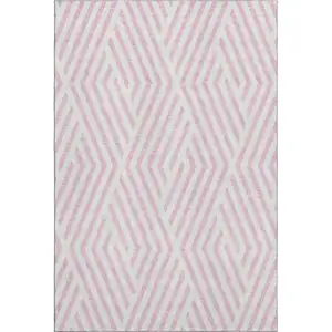 Photo of Pink And Ivory Geometric Washable Area Rug With UV Protection