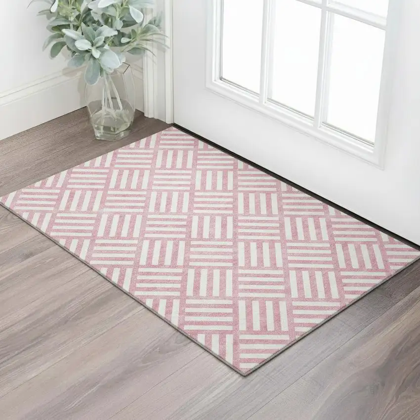 Pink And Ivory Geometric Washable Area Rug With UV Protection Photo 1