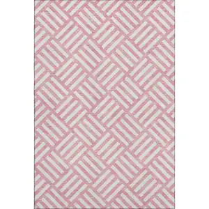Photo of Pink And Ivory Geometric Washable Area Rug With UV Protection
