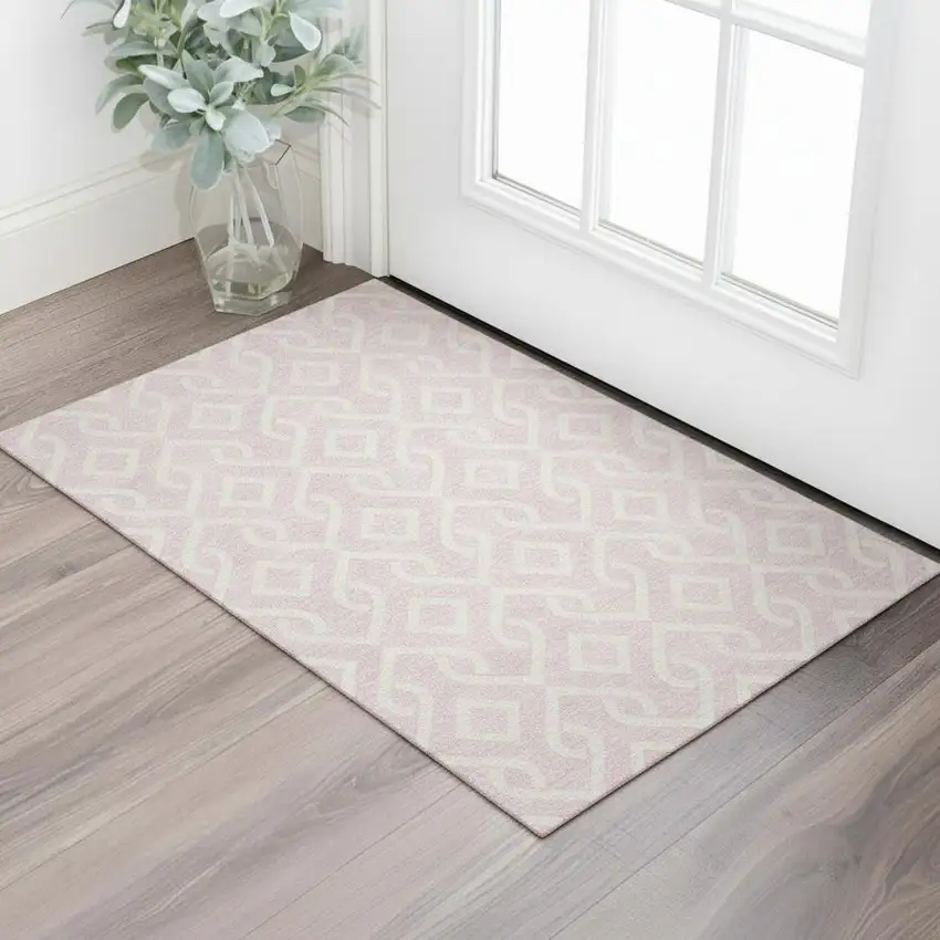Pink And Ivory Geometric Washable Area Rug With UV Protection Photo 1