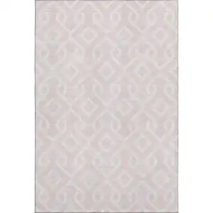 Photo of Pink And Ivory Geometric Washable Area Rug With UV Protection