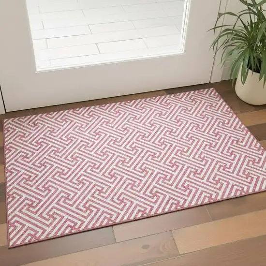 Pink And Ivory Geometric Washable Area Rug With UV Protection Photo 1