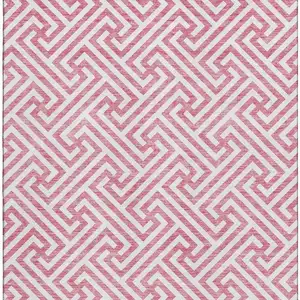 Photo of Pink And Ivory Geometric Washable Area Rug With UV Protection