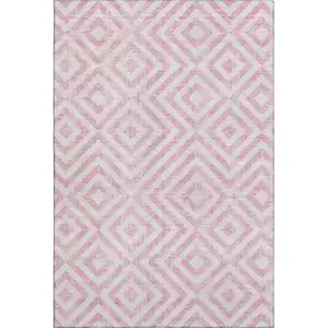 Photo of Pink And Ivory Geometric Washable Area Rug With UV Protection