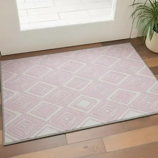 Pink And Ivory Geometric Washable Area Rug With UV Protection Photo 1