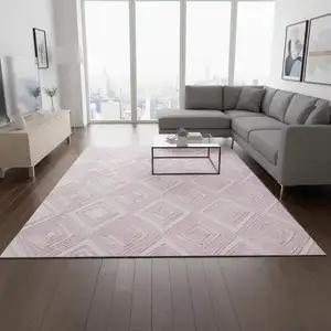Photo of Pink And Ivory Geometric Washable Area Rug With UV Protection