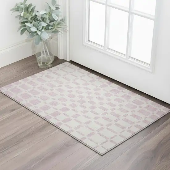 Pink And Ivory Geometric Washable Area Rug With UV Protection Photo 2