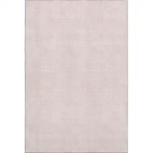 Photo of Pink And Ivory Geometric Washable Area Rug With UV Protection