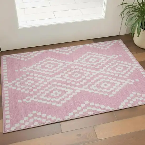 Pink And Ivory Geometric Washable Area Rug With UV Protection Photo 1