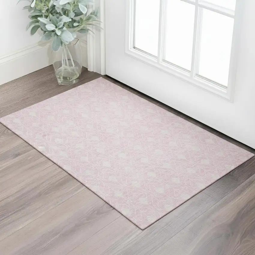 Pink And Ivory Geometric Washable Area Rug With UV Protection Photo 1