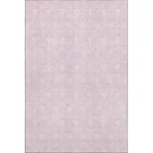 Photo of Pink And Ivory Geometric Washable Area Rug With UV Protection