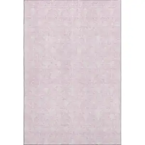 Photo of Pink And Ivory Geometric Washable Area Rug With UV Protection