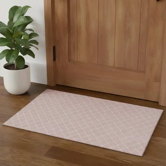 Pink And Ivory Geometric Washable Area Rug With UV Protection Photo 1
