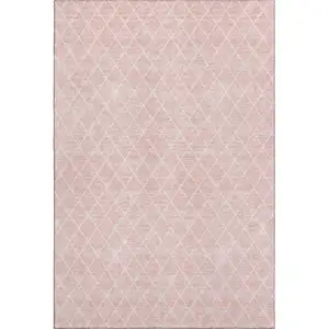 Photo of Pink And Ivory Geometric Washable Area Rug With UV Protection