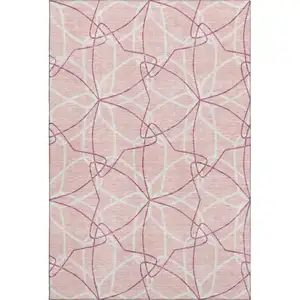 Photo of Pink And Ivory Geometric Washable Area Rug With UV Protection