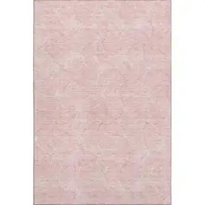 Photo of Pink And Ivory Geometric Washable Area Rug With UV Protection