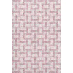 Photo of Pink And Ivory Geometric Washable Area Rug With UV Protection