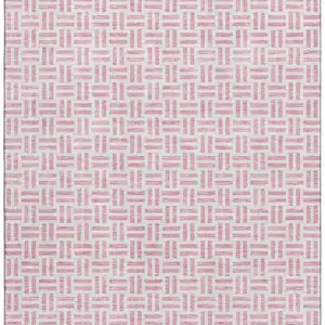 Photo of Pink And Ivory Geometric Washable Area Rug With UV Protection