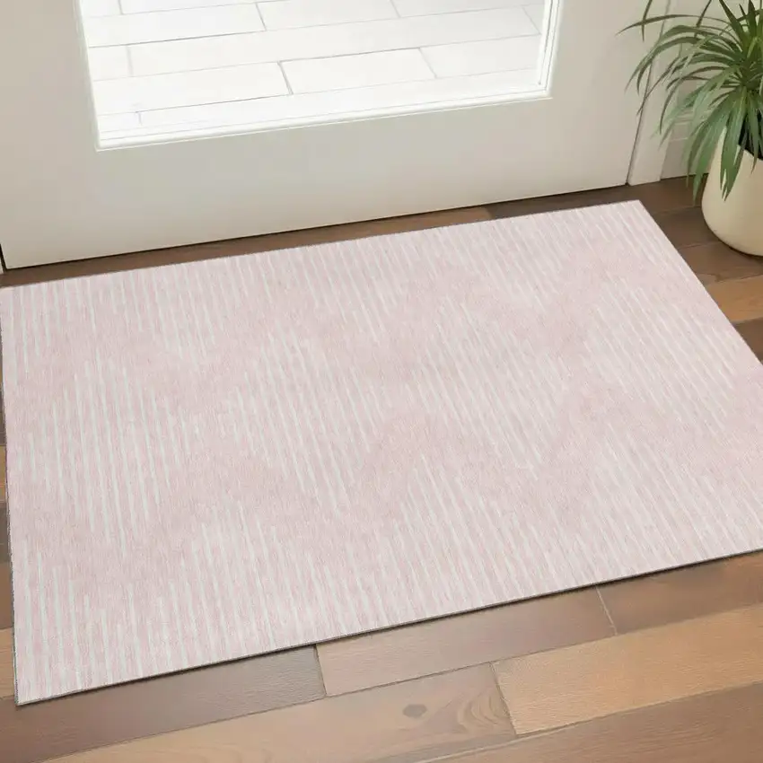 Pink And Ivory Geometric Washable Area Rug With UV Protection Photo 1