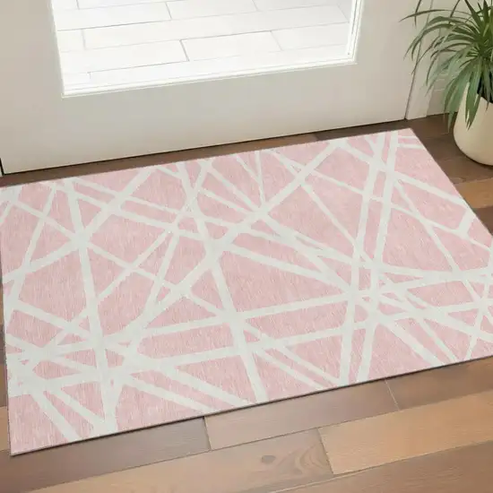 Pink And Ivory Geometric Washable Area Rug With UV Protection Photo 1