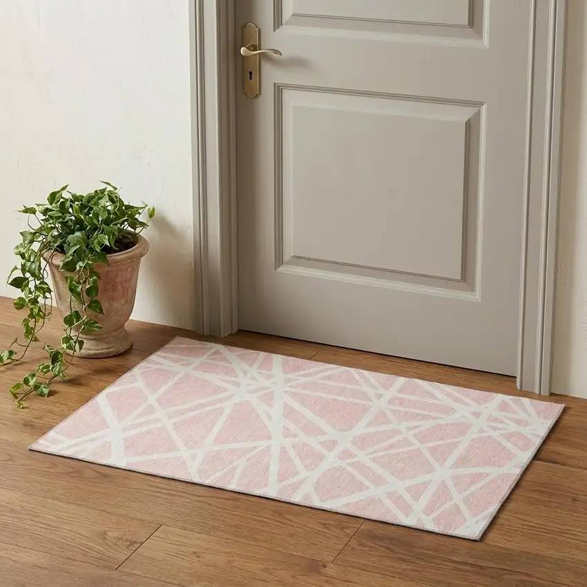 Pink And Ivory Geometric Washable Area Rug With UV Protection Photo 1