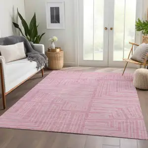 Photo of Pink And Ivory Geometric Washable Area Rug With UV Protection