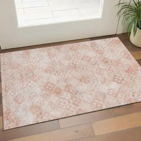 Pink And Ivory Geometric Washable Area Rug With UV Protection Photo 1