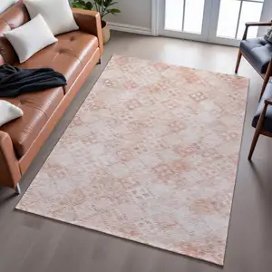 Photo of Pink And Ivory Geometric Washable Area Rug With UV Protection