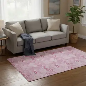 Photo of Pink And Ivory Geometric Washable Area Rug With UV Protection