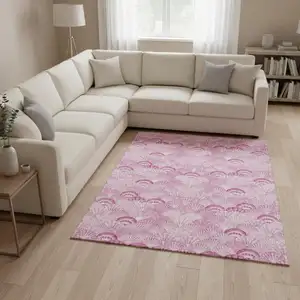 Photo of Pink And Ivory Geometric Washable Area Rug With UV Protection