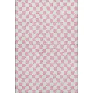 Photo of Pink And Ivory Geometric Washable Area Rug With UV Protection