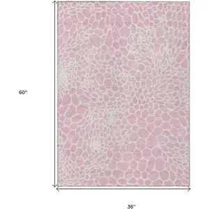Photo of Pink And Ivory Geometric Washable Indoor Outdoor Area Rug